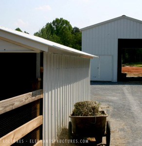 Large metal garage and animal shelter.