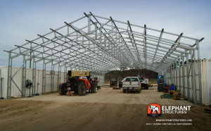Extra framing with extra wide dimensions of a commercial metal building in the process of an installation.