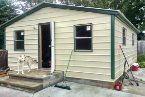 Steel building garage tiny home from the exterior.